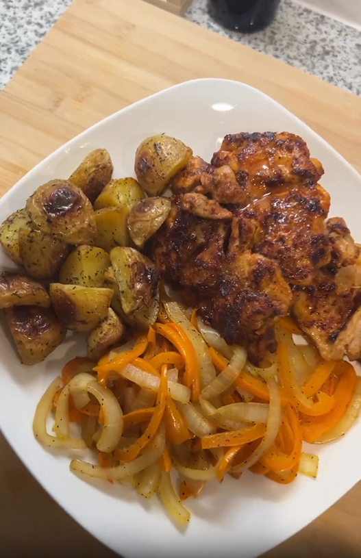 Chicken Thighs with Roasted Baby Potatoes and Sauteed Onion and Bell Pepper